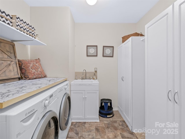 10 Clubside Dr, Asheville, NC 28804 - clothes washing area featuring stone finish flooring, washer and dryer, a sink, and cabinet space