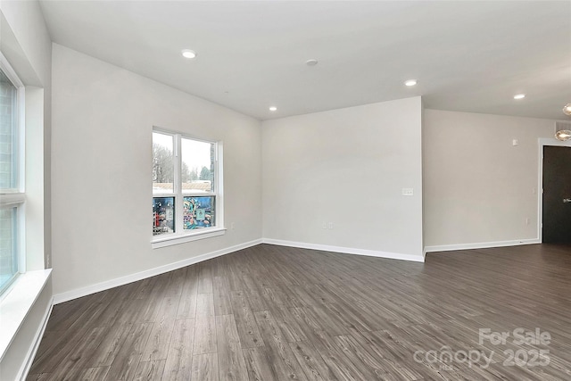 empty room featuring dark hardwood / wood-style floors