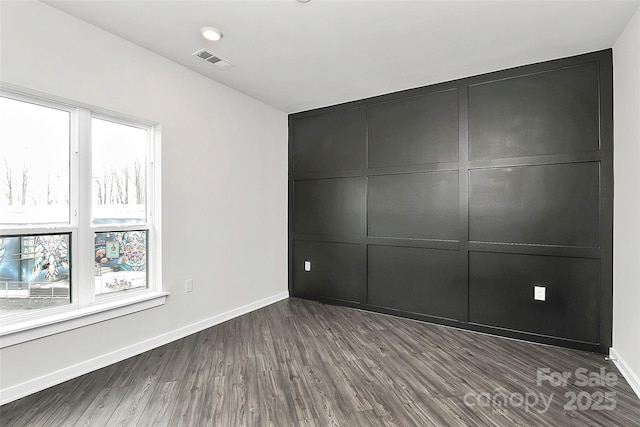 unfurnished bedroom featuring hardwood / wood-style flooring