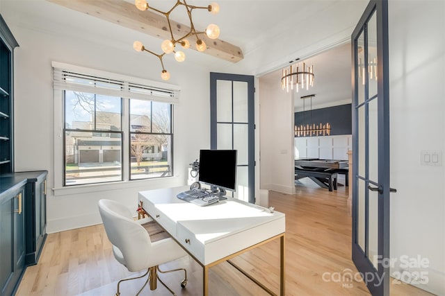 office with light wood-type flooring, a chandelier, beam ceiling, and french doors