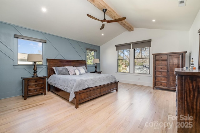 bedroom with ceiling fan, vaulted ceiling with beams, and light hardwood / wood-style floors