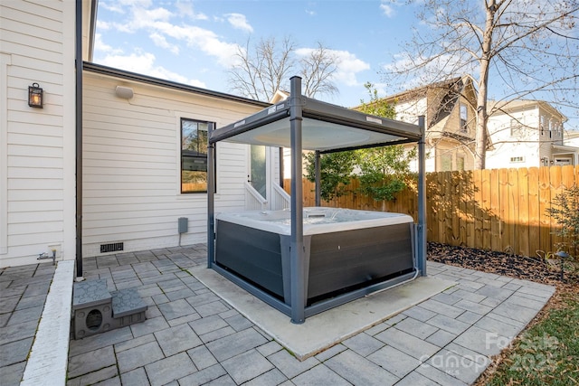 view of patio featuring a hot tub