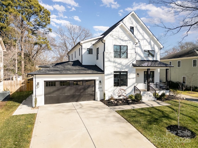 modern farmhouse style home featuring central air condition unit, a front lawn, a porch, and a garage