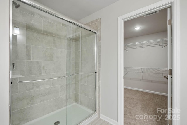 bathroom featuring an enclosed shower