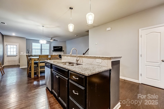 kitchen with ceiling fan, dishwasher, sink, and hanging light fixtures