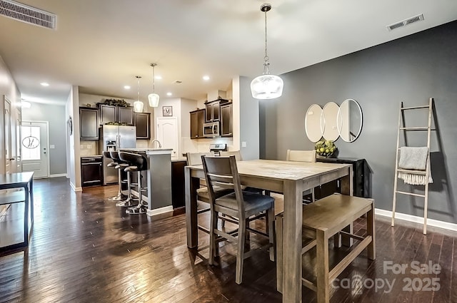 dining area featuring dark hardwood / wood-style flooring