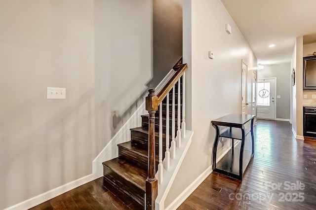 stairway with wood-type flooring