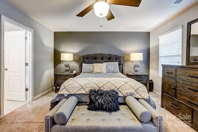 bedroom featuring light carpet and ceiling fan