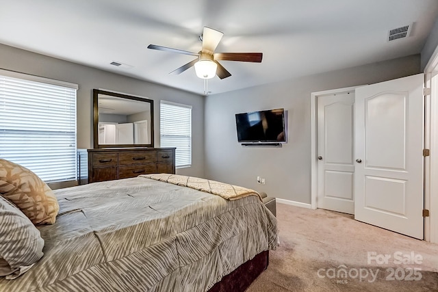 carpeted bedroom featuring ceiling fan