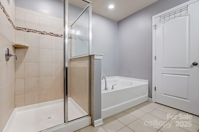 bathroom with tile patterned floors and plus walk in shower