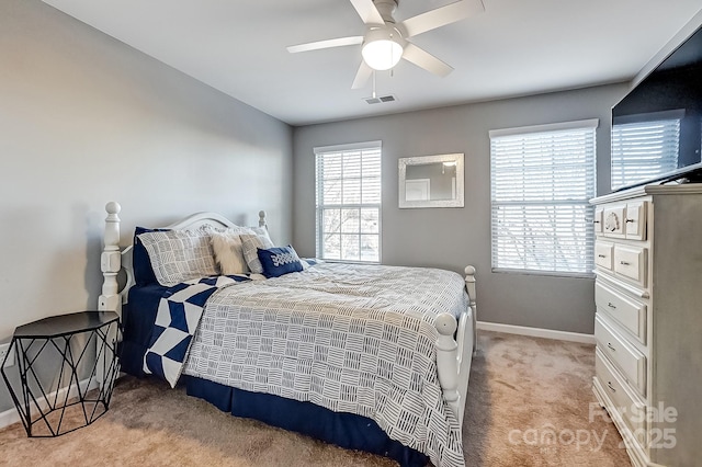 bedroom featuring ceiling fan and light colored carpet