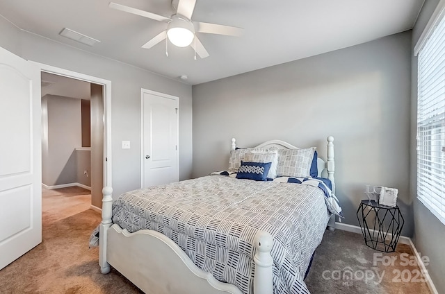 carpeted bedroom with ceiling fan