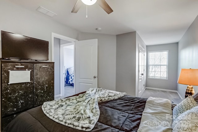 bedroom featuring ceiling fan and light carpet