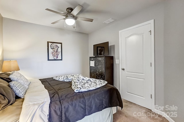 carpeted bedroom featuring ceiling fan