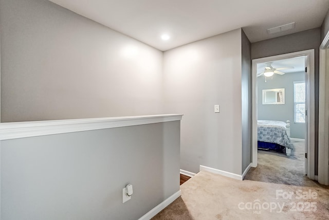 hallway with carpet flooring