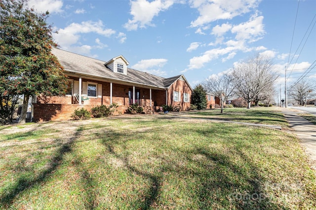 view of front facade featuring a front lawn and a porch