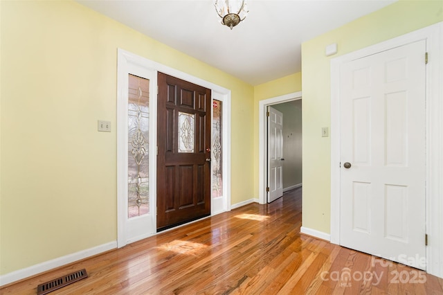 foyer entrance with light hardwood / wood-style flooring