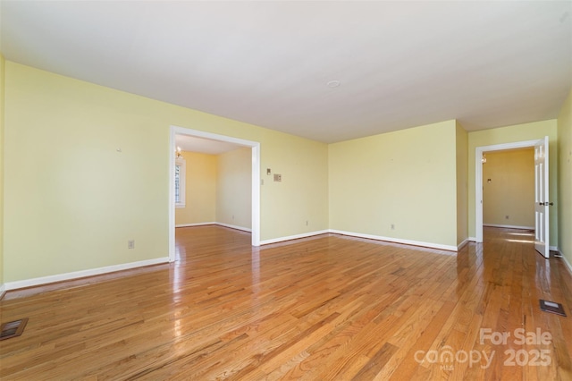 spare room featuring light wood-type flooring