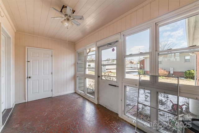 entryway with ceiling fan and wooden ceiling