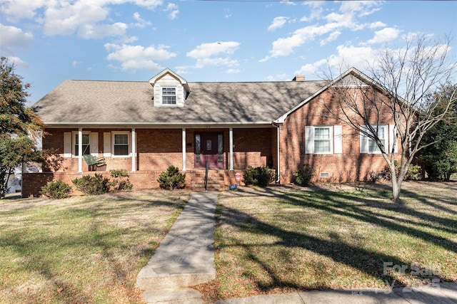 view of front of property featuring covered porch and a front yard