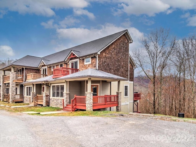 view of front of house with a balcony