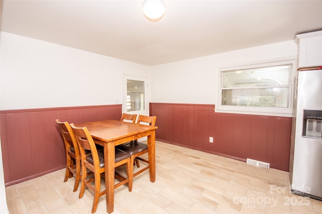 dining area with light hardwood / wood-style flooring