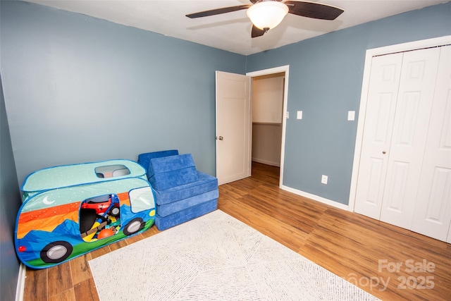 recreation room featuring ceiling fan and hardwood / wood-style floors