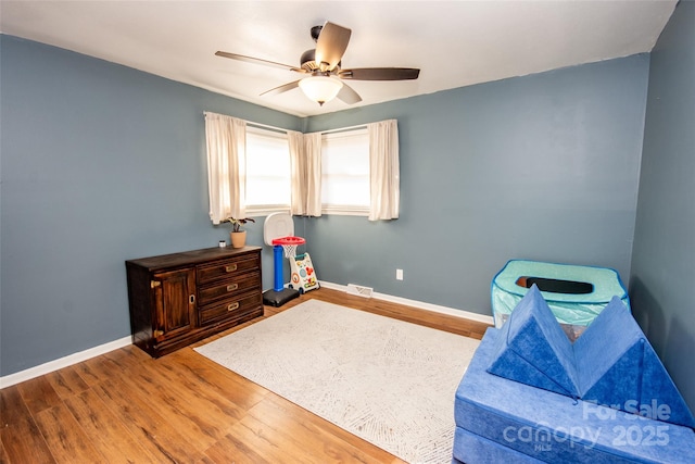 interior space with ceiling fan and hardwood / wood-style floors