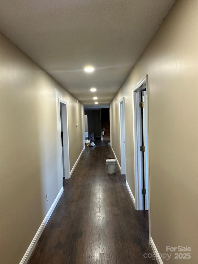 hall featuring dark wood-type flooring