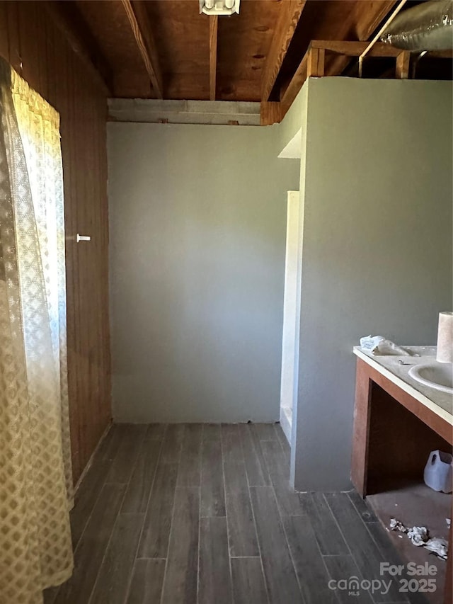 interior space with vanity and hardwood / wood-style flooring