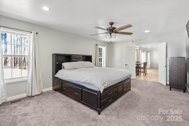 carpeted bedroom with ceiling fan