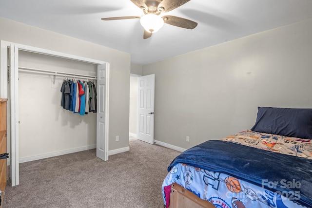 bedroom with ceiling fan, light colored carpet, and a closet