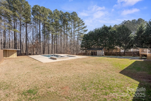 view of yard with a shed and a patio