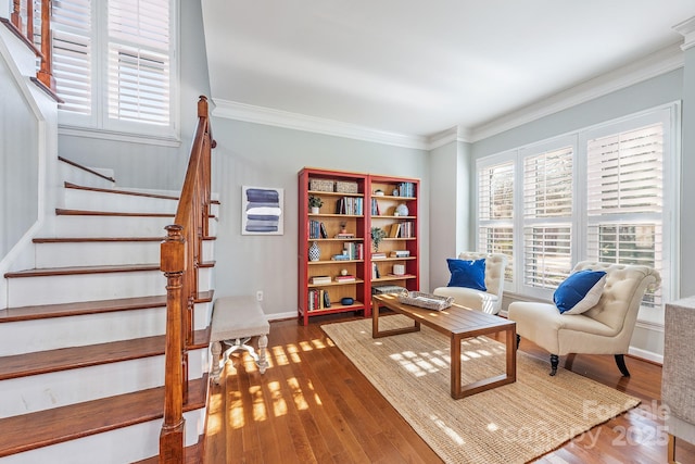 living area featuring crown molding and dark hardwood / wood-style floors