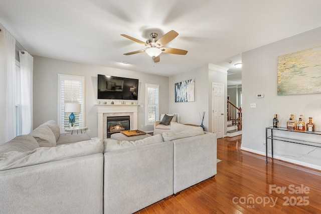 living room with hardwood / wood-style flooring and ceiling fan