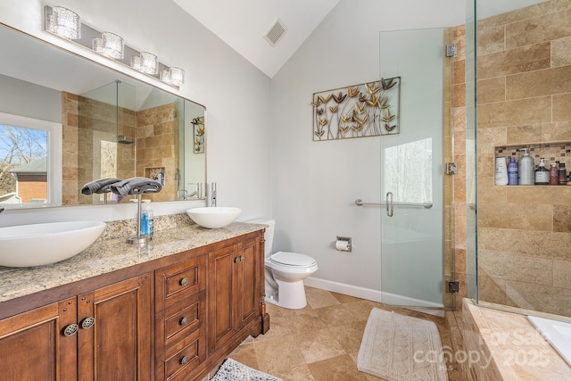 bathroom featuring lofted ceiling, toilet, walk in shower, and vanity