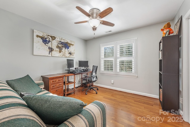 office space featuring light wood-type flooring and ceiling fan