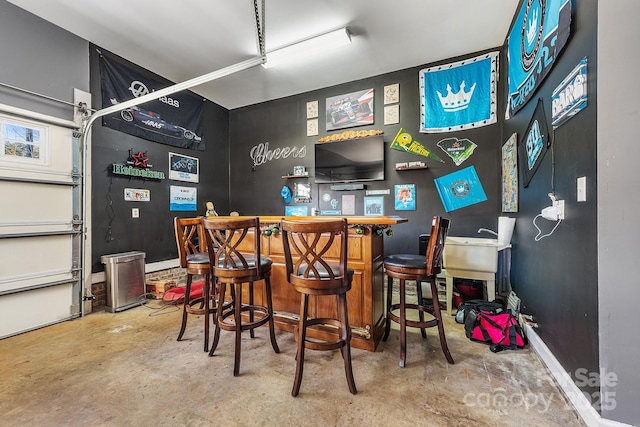 bar with concrete flooring