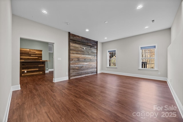 empty room featuring dark wood-type flooring