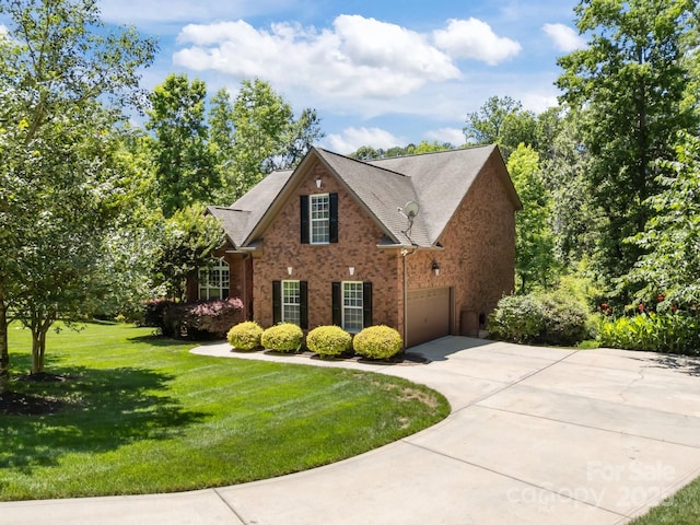 254 Streamside Pl, Mooresville, NC 28115 - view of front of home with concrete driveway, brick siding, and a front lawn
