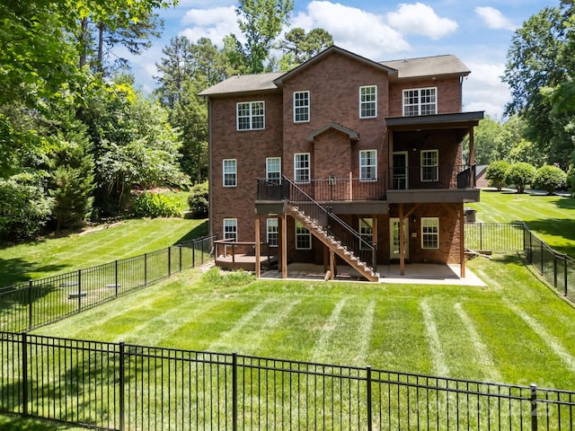 254 Streamside Pl, Mooresville, NC 28115 - back of house with a patio, a fenced backyard, a deck, brick siding, and stairs