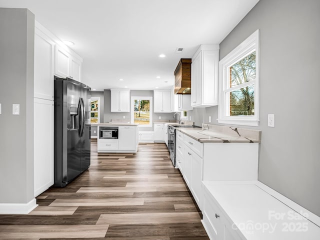 kitchen with sink, white cabinetry, appliances with stainless steel finishes, and dark hardwood / wood-style flooring