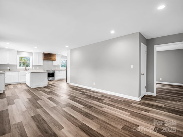 unfurnished living room featuring wood-type flooring