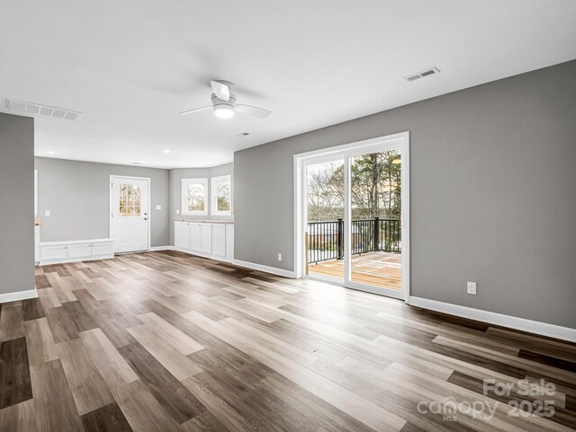 spare room with ceiling fan and light hardwood / wood-style floors