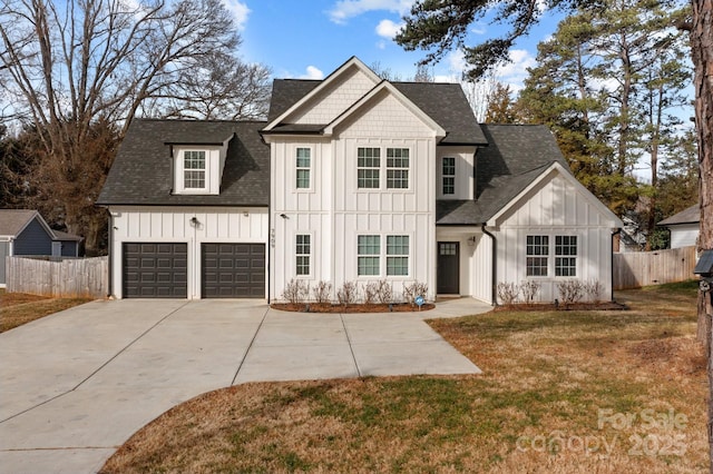 view of front of house with a garage and a front yard