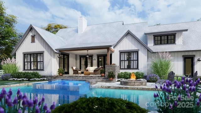 back of house with a fire pit, an outdoor pool, a chimney, a ceiling fan, and board and batten siding