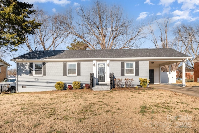 single story home with a front lawn and a carport