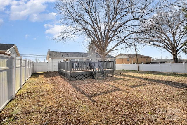 view of yard featuring a wooden deck