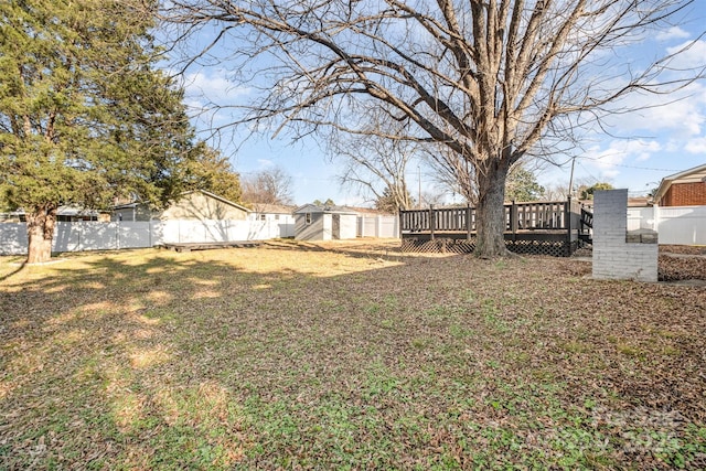 view of yard with a deck