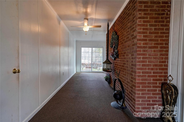 corridor with carpet floors and crown molding